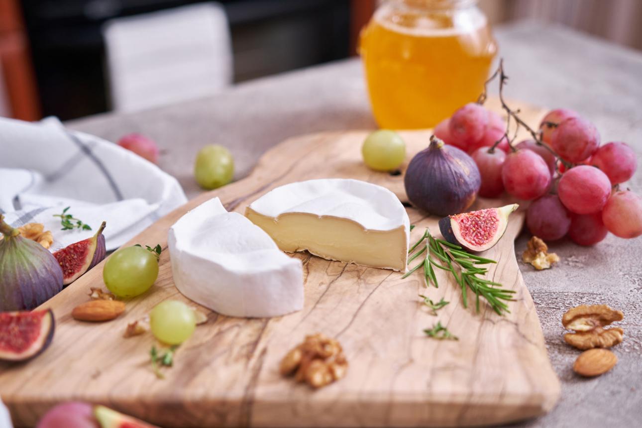 brie cheese wheel and slice