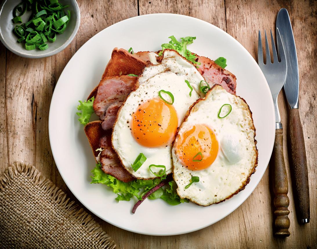 fried eggs in pan sunny side up